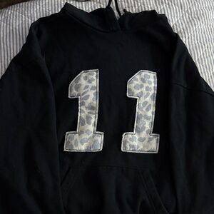 Pacsun black Hoodie with Light Gray Leopard '11' Appliqué